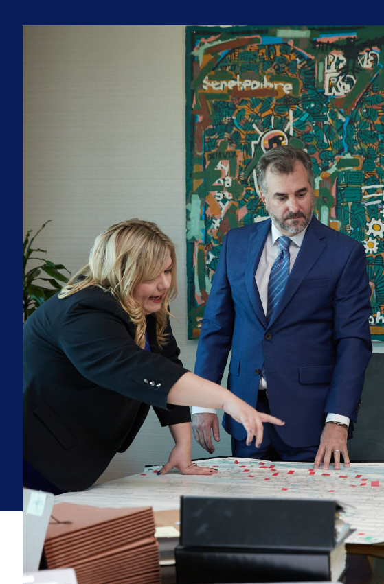 ashley liuzza pointing at a map during a meeting