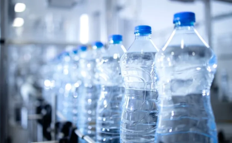 plastic water bottles on an assembly line