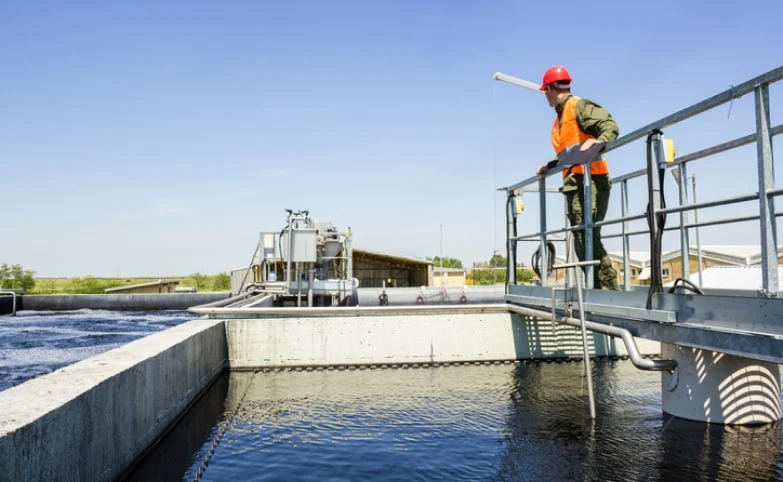 worker at a water treatment facility