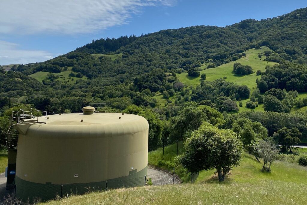 a public water tank in a wooded area holding public drinking water