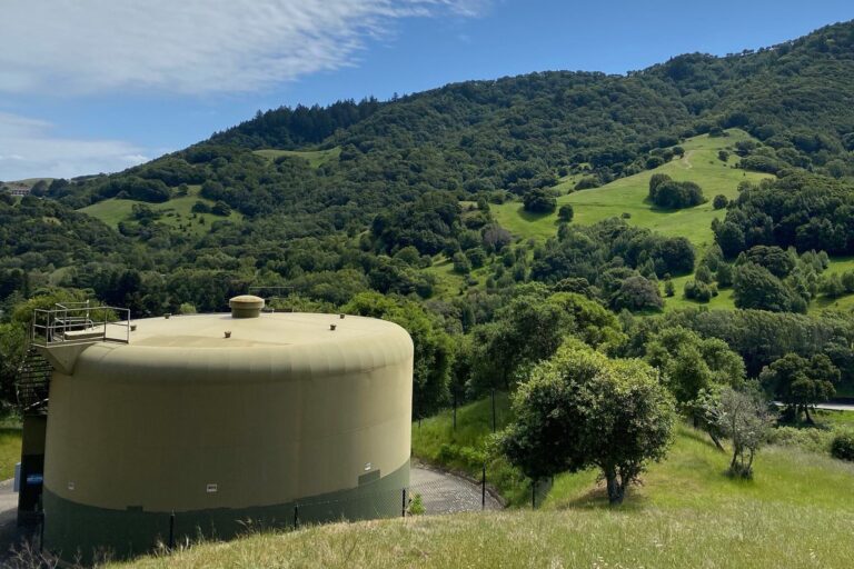 a public water tank in a wooded area holding public drinking water