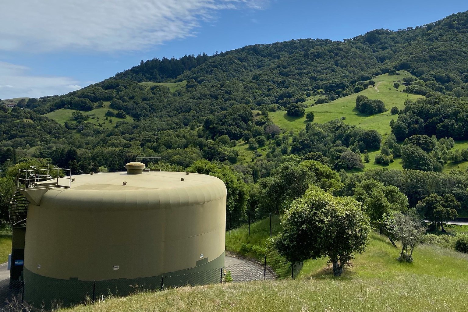 a public water tank in a wooded area holding public drinking water